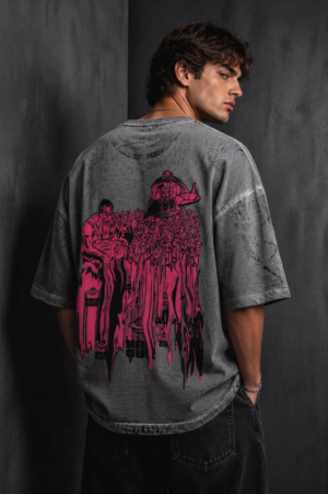 Male model wearing Makouk Studios grey acid wash oversized graphic T-shirt, back view with profile.